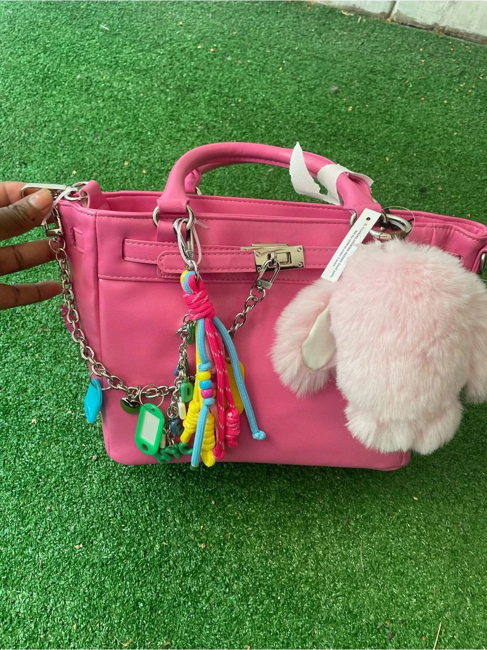 Pink Madden NYC satchelhandbag with plus charm